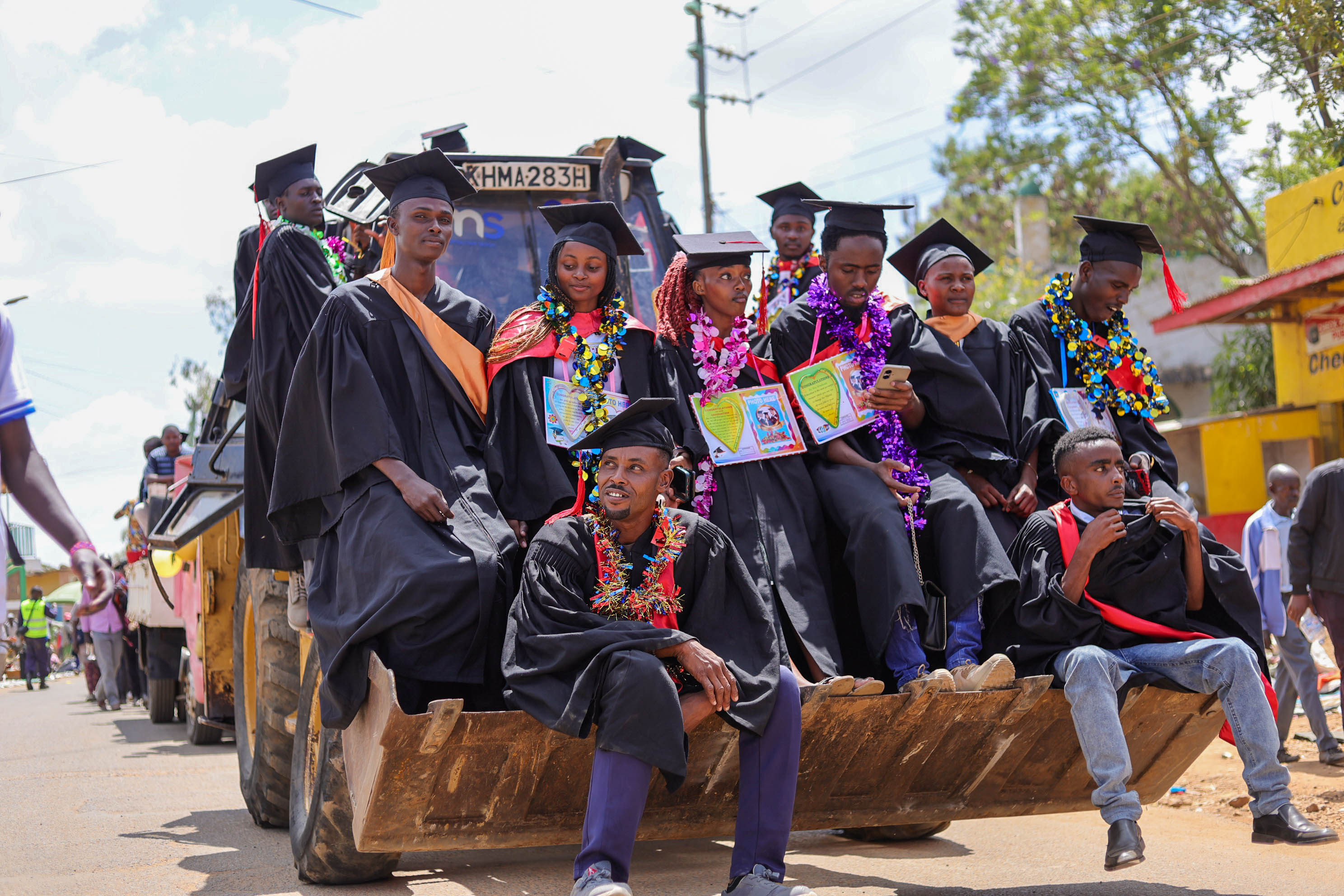 Graduating students on backhoe | Plant Operators School